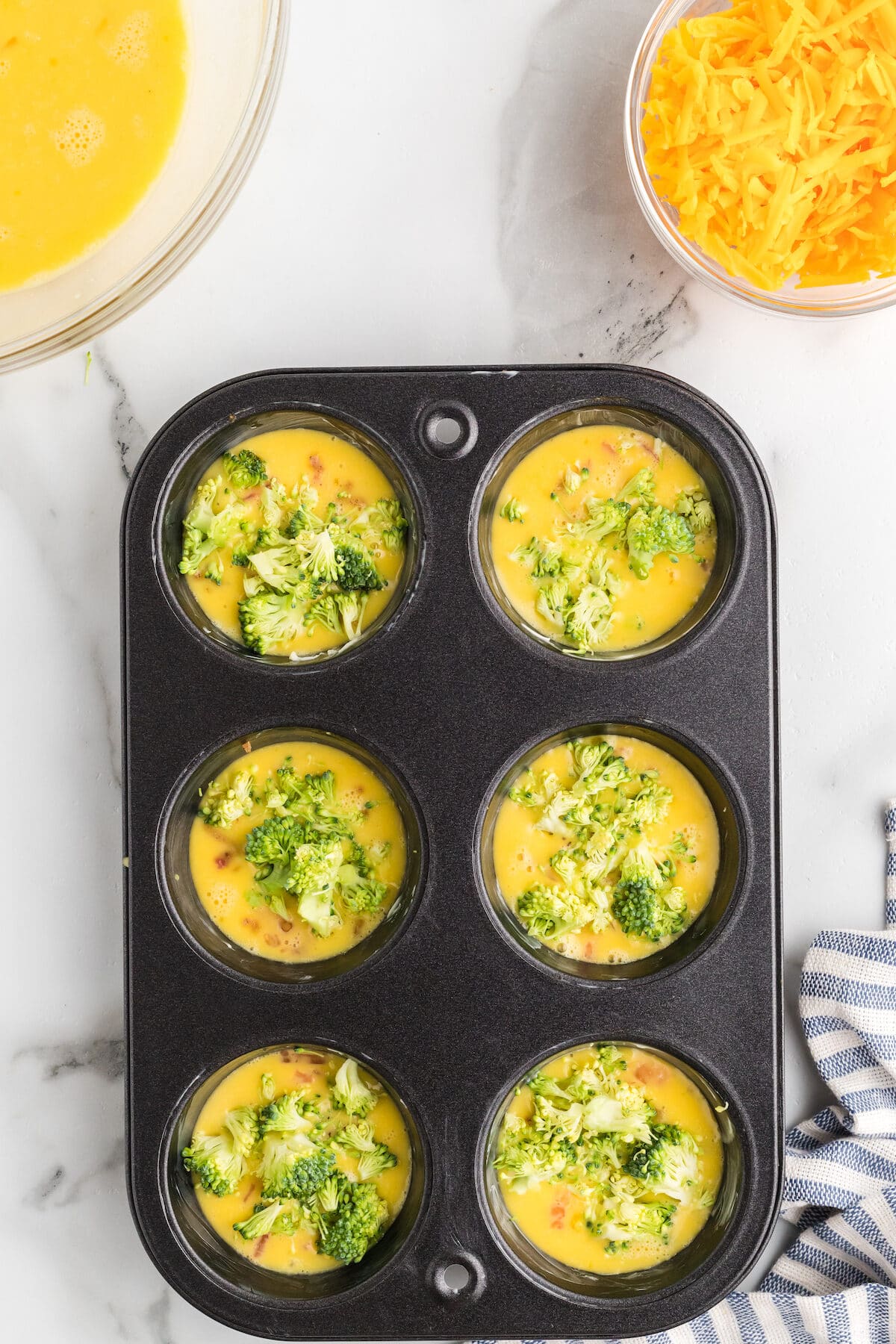 chopped broccoli in the egg muffin cups. 