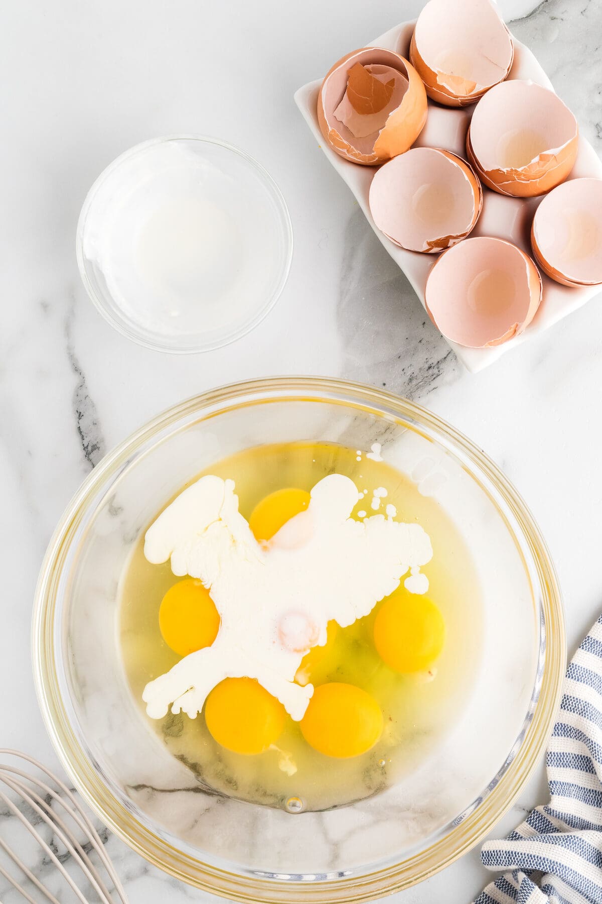 eggs and heavy cream in a large glass bowl. 