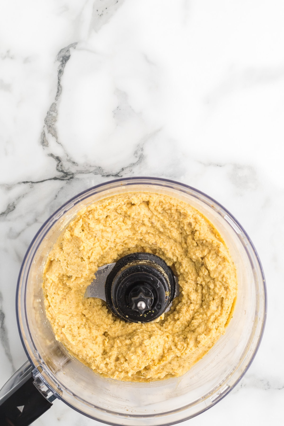 creamy hummus in a food processor.