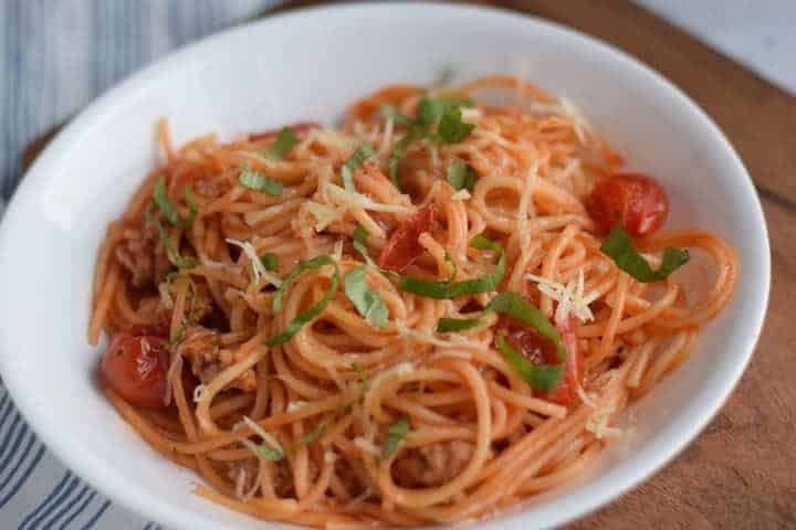spaghetti with basil garnish