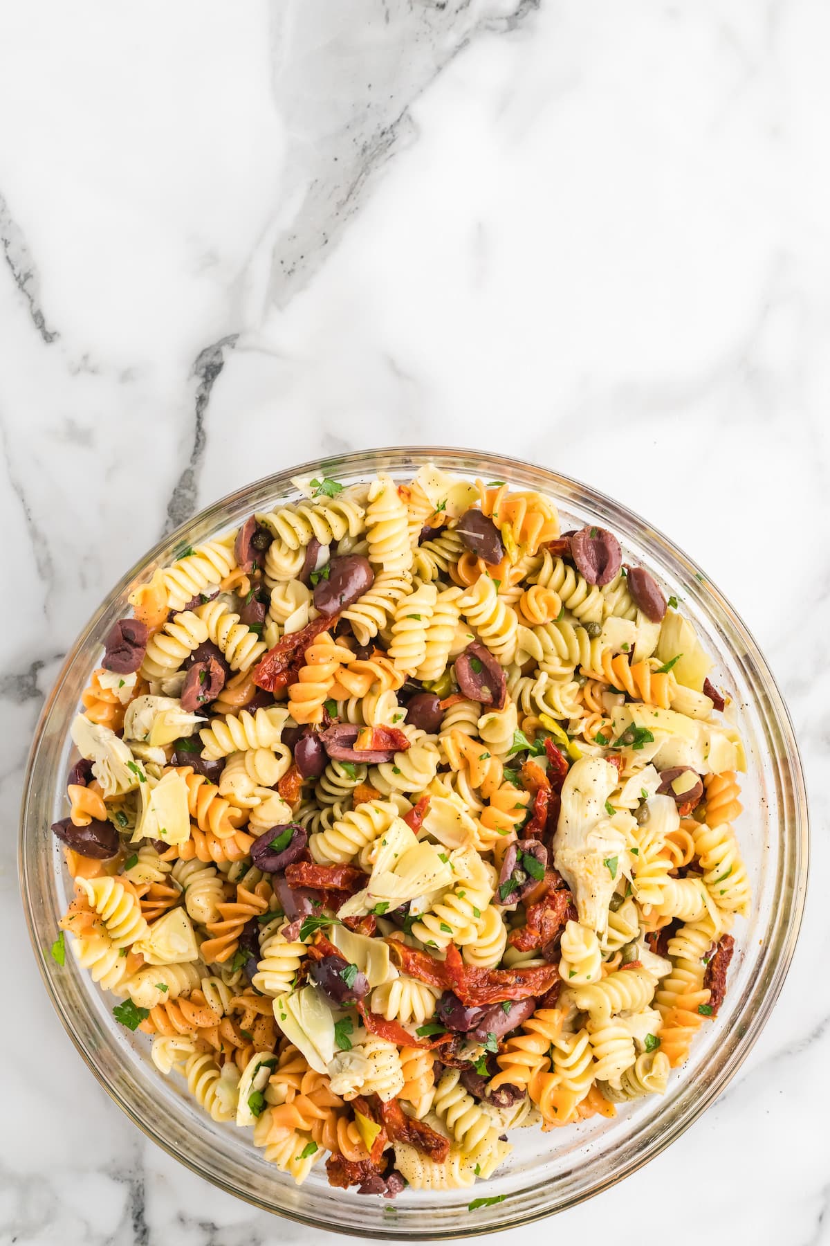 large bowl of the finished mediterranean pasta salad.