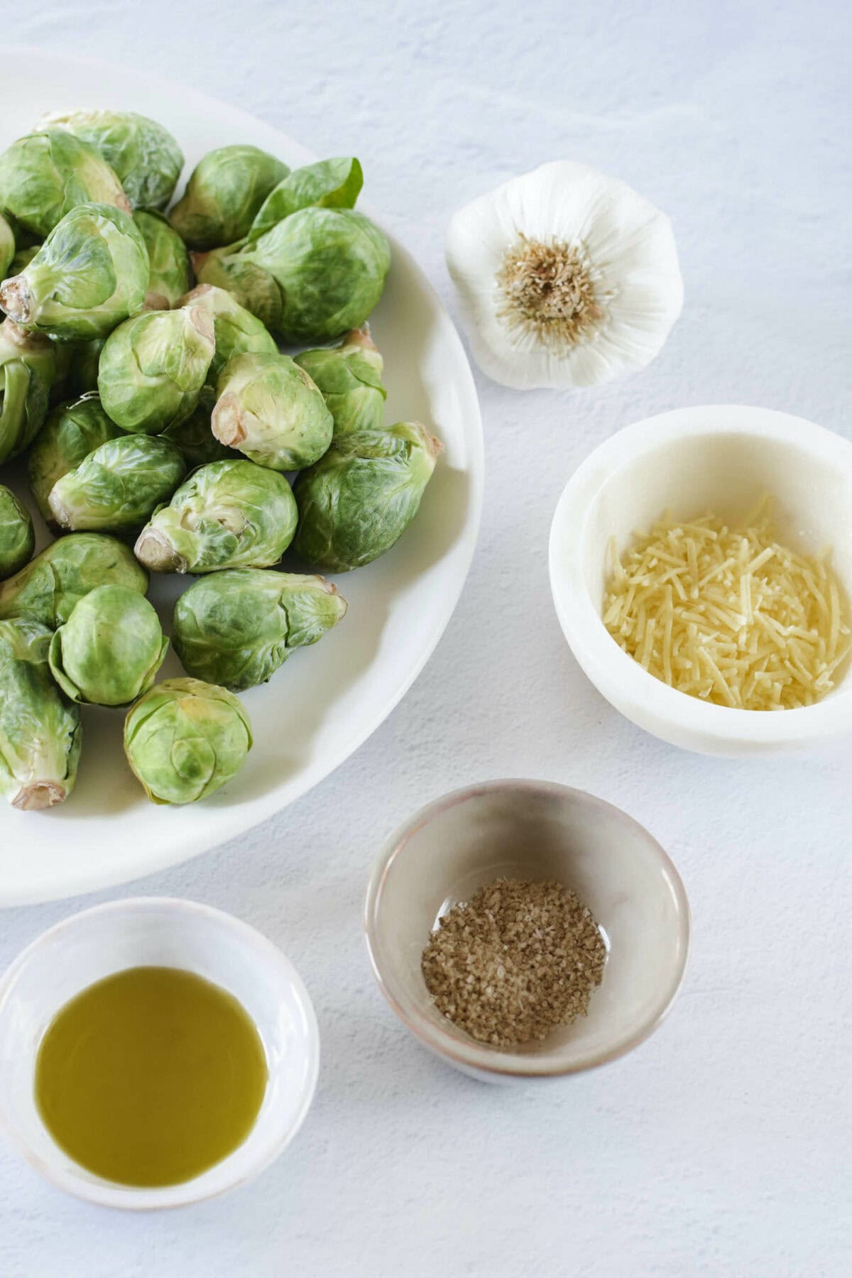 ingredients for the Brussels sprouts in small bowls. 