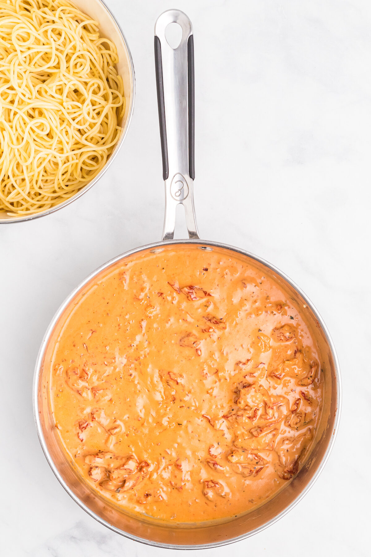 creamy tomato sauce in the skillet. 