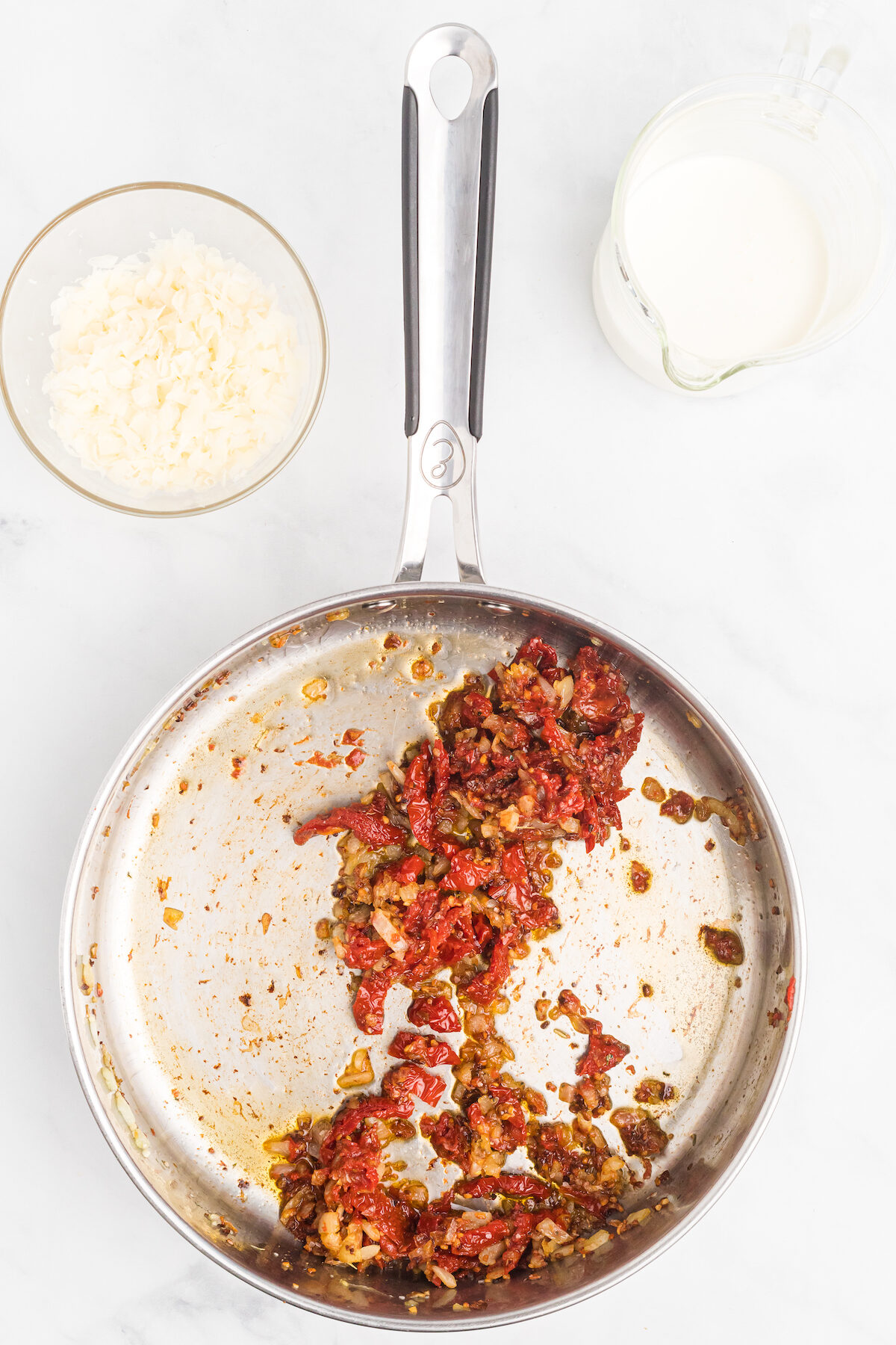 tomatoes added to the skillet. 