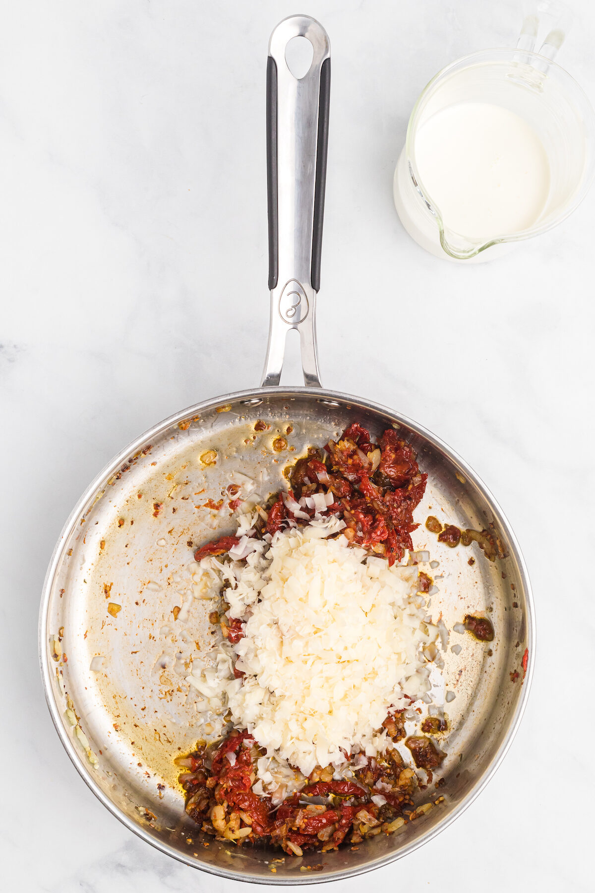 the pecorino cheese added to the tomato paste mixture. 