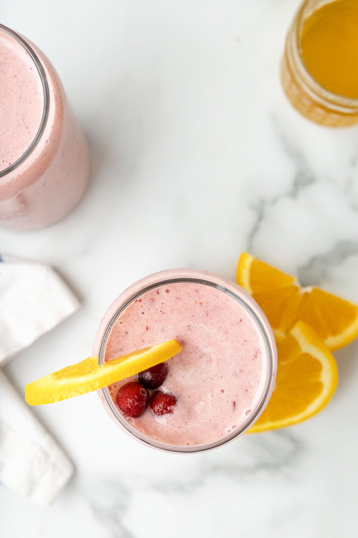 two glasses at a birds eye view of the cranberry smoothies. 