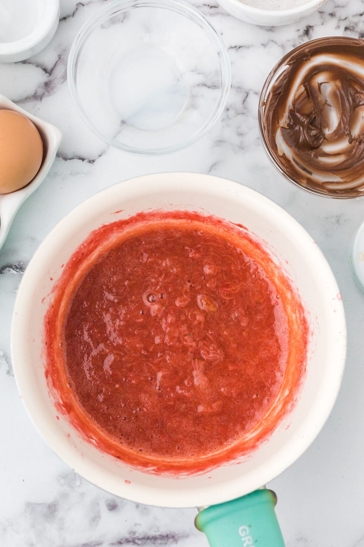 strawberry sauce in a white bowl. 