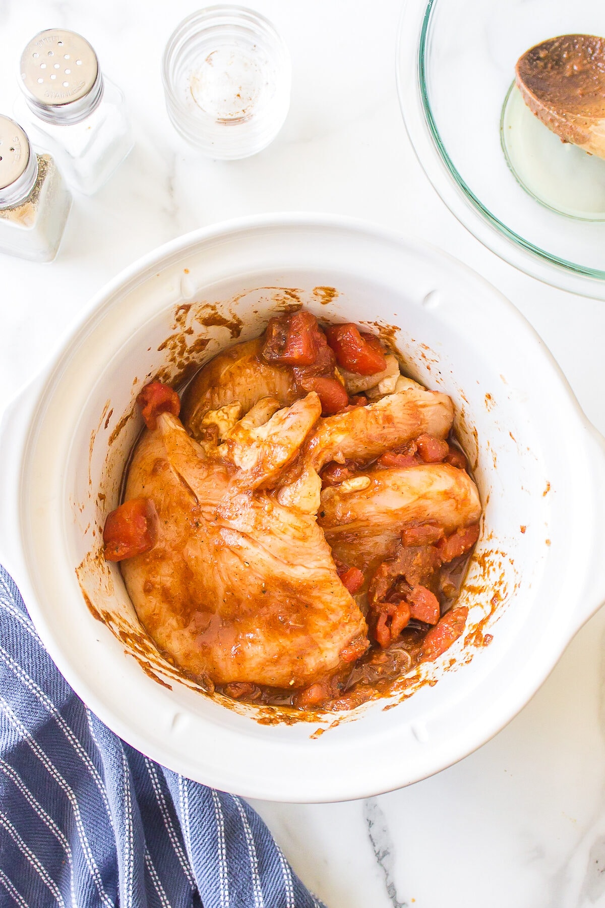 chicken breasts added to top of slow cooker
