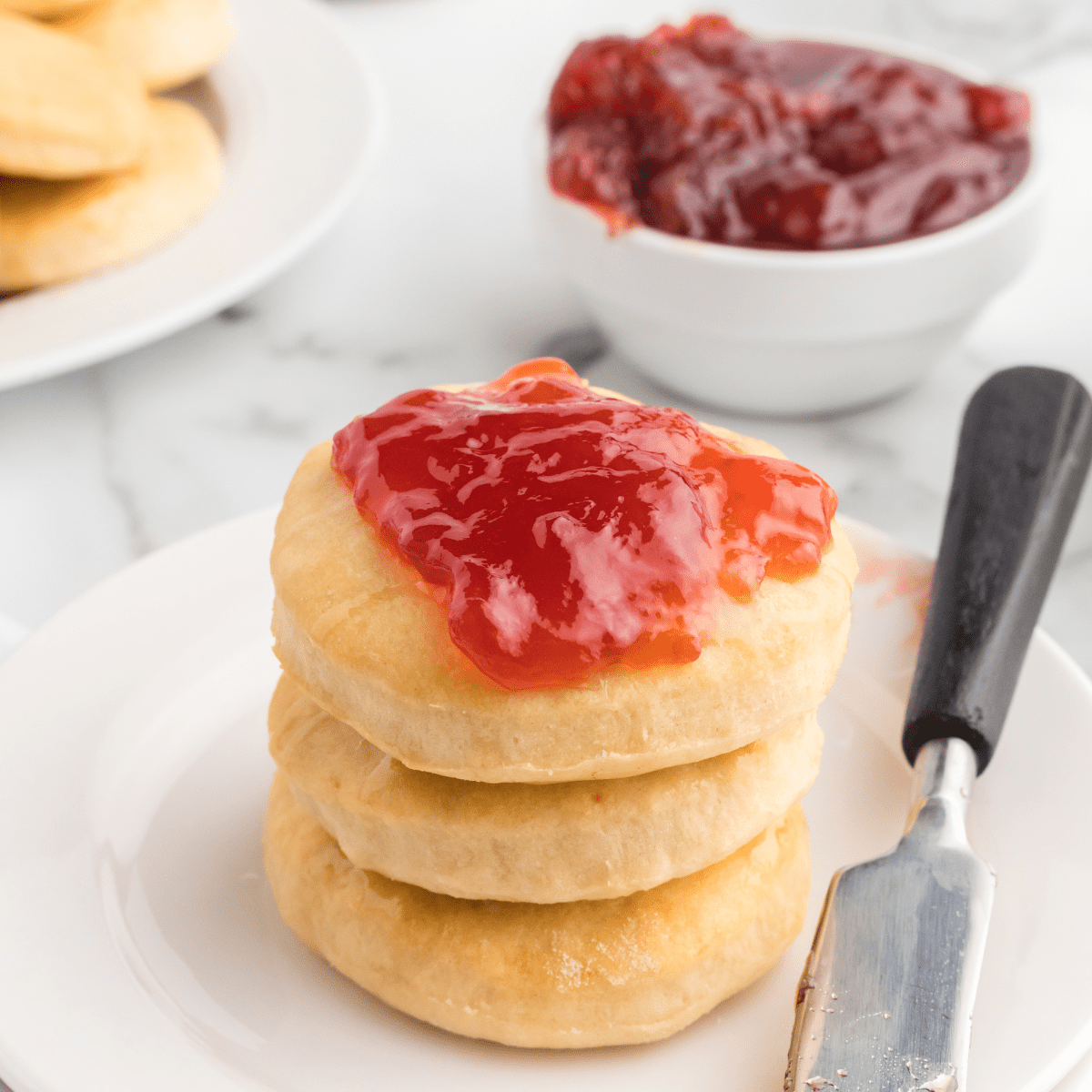honey butter scones with jam on top