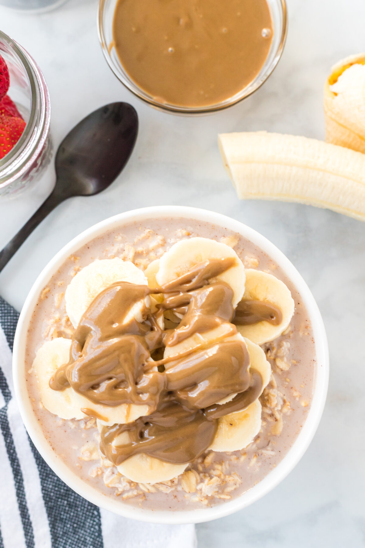 overnight oats topped with almond butter and bananas.