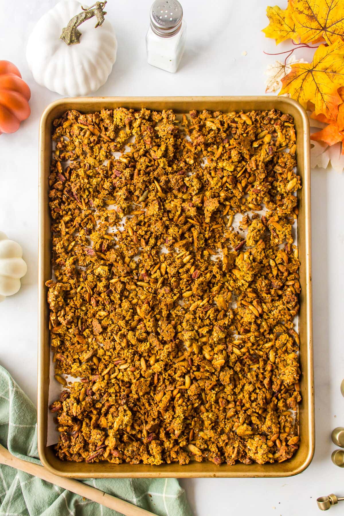 finished pumpkin granola on a large baking sheet. 