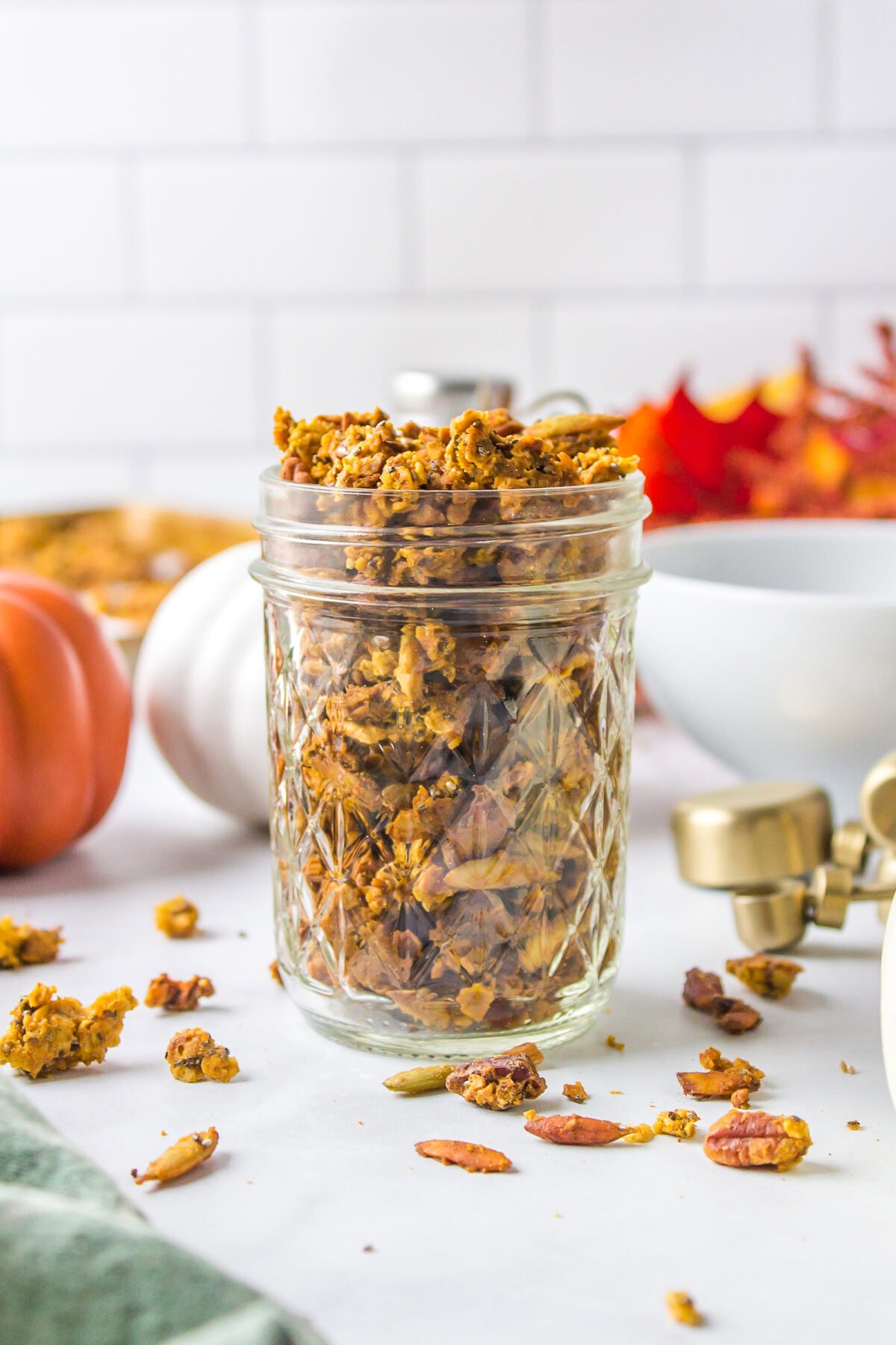 pumpkin maple granola recipe finished in a small mason jar.