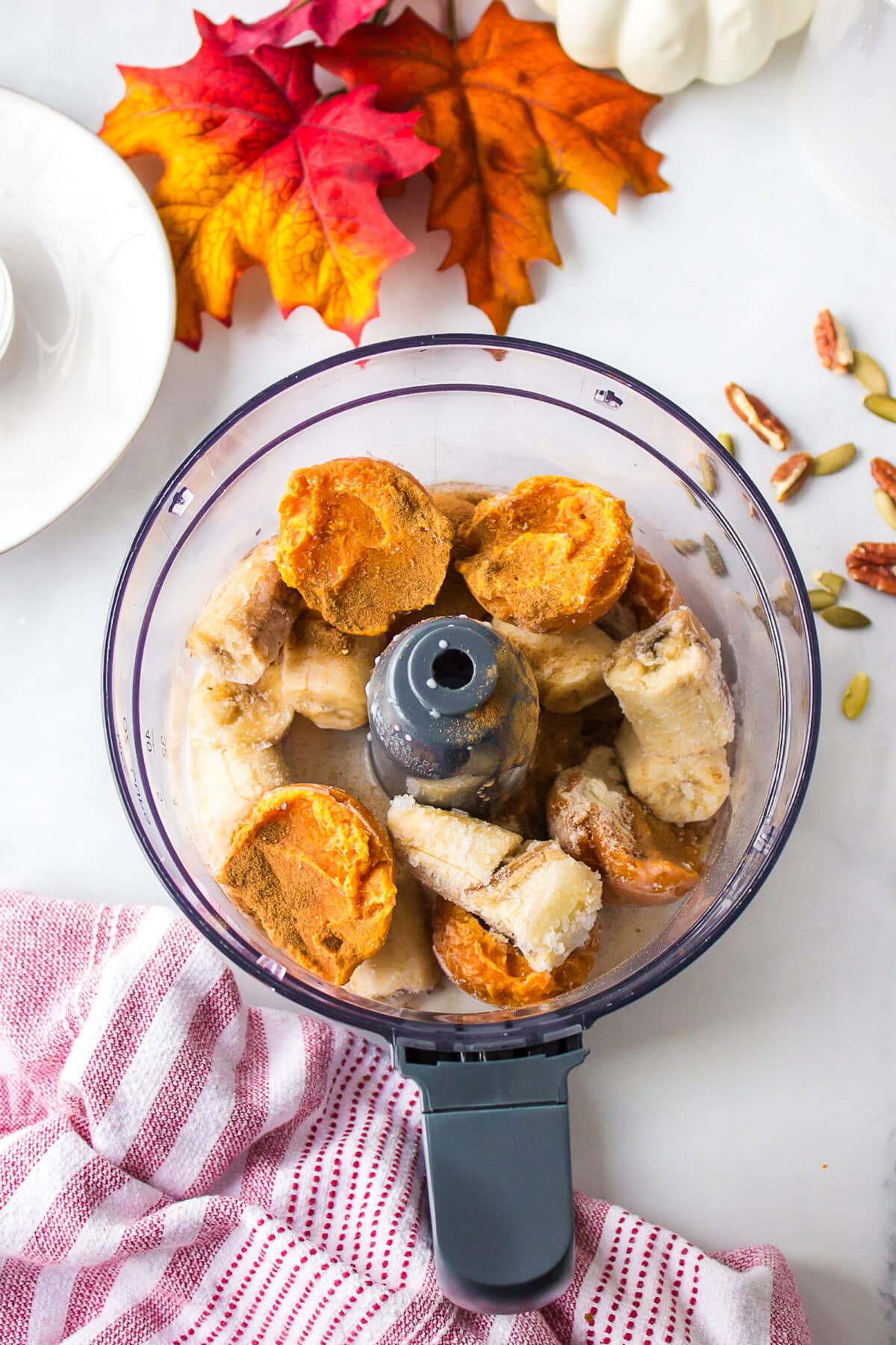 ingredients for the pumpkin smoothie bowl in the blender bowl. 