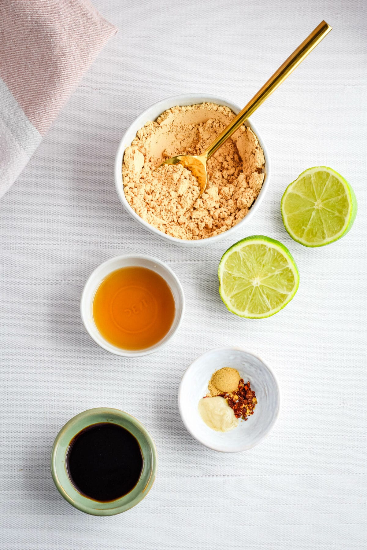 ingredients used for the Thai peanut sauce in small bowls.