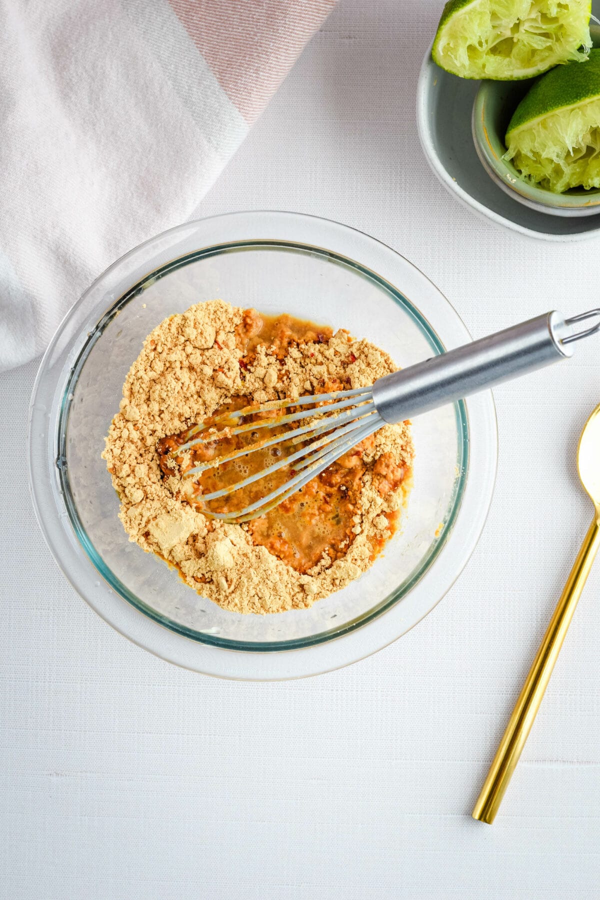 powdered peanut butter in a bowl with fresh lime juice squeezed over top. 